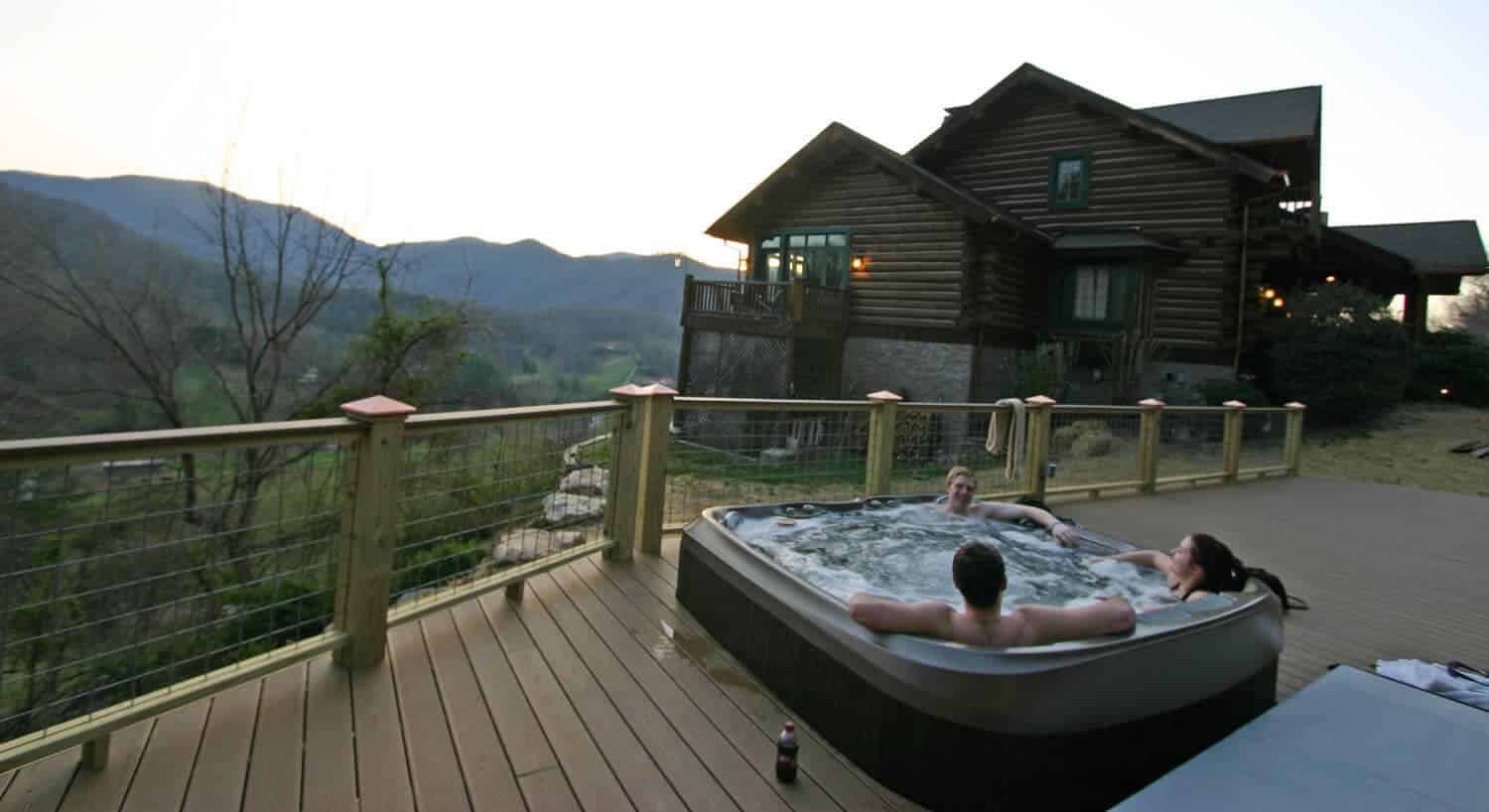 Wildberry Lodge main lodge at dusk with the hot tub deck